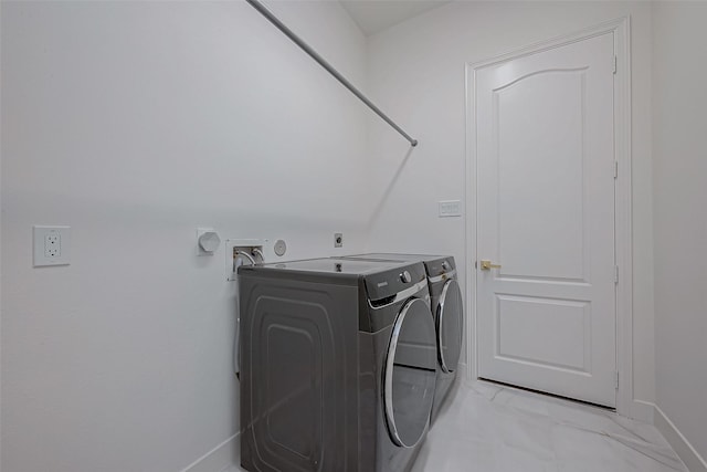 laundry area with independent washer and dryer