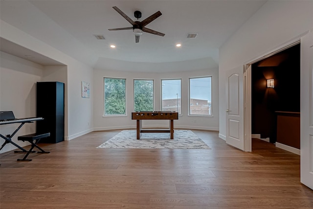 playroom with ceiling fan and light wood-type flooring