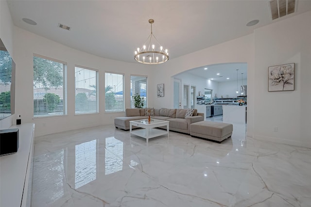 living room featuring a notable chandelier