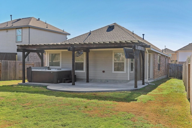 back of house featuring a hot tub, a patio, a yard, and cooling unit