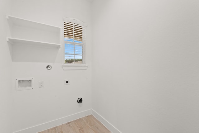 laundry room featuring hookup for an electric dryer, hookup for a gas dryer, hookup for a washing machine, and light wood-type flooring