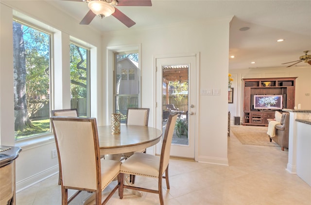 dining area with ceiling fan and ornamental molding