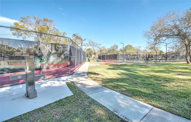 view of yard featuring tennis court