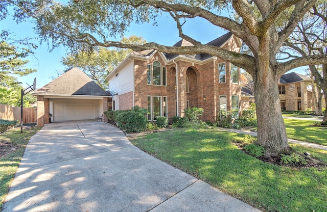 view of front of home with a garage and a front lawn