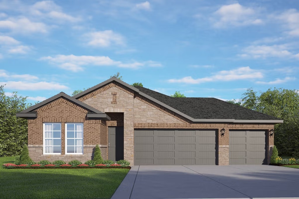 view of front of property featuring a garage and a front lawn