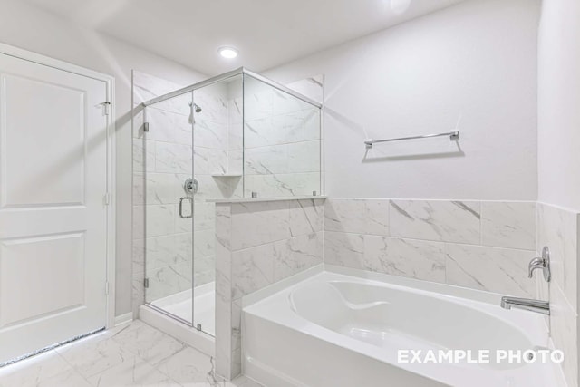 full bathroom featuring marble finish floor, recessed lighting, a garden tub, and a stall shower