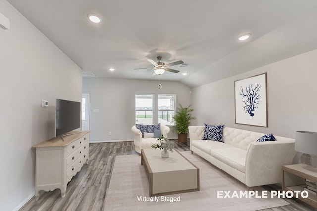 living area featuring visible vents, lofted ceiling, light wood-style flooring, ceiling fan, and recessed lighting