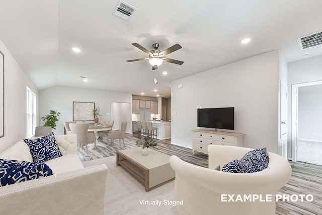 living area with light wood-style floors, visible vents, a ceiling fan, and recessed lighting