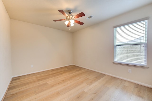 empty room featuring ceiling fan and light hardwood / wood-style floors