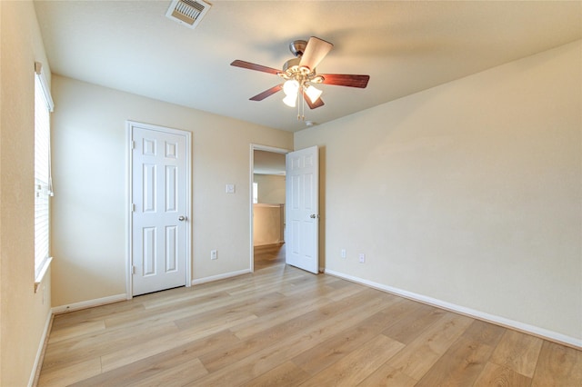 unfurnished bedroom featuring light wood-type flooring and ceiling fan