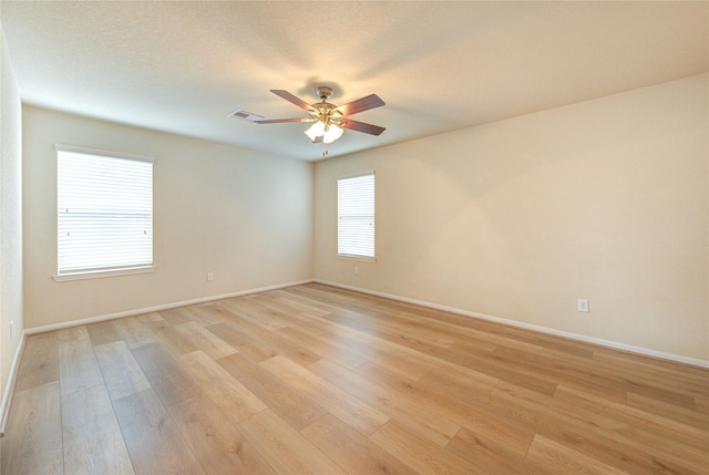 unfurnished room with light hardwood / wood-style floors and ceiling fan