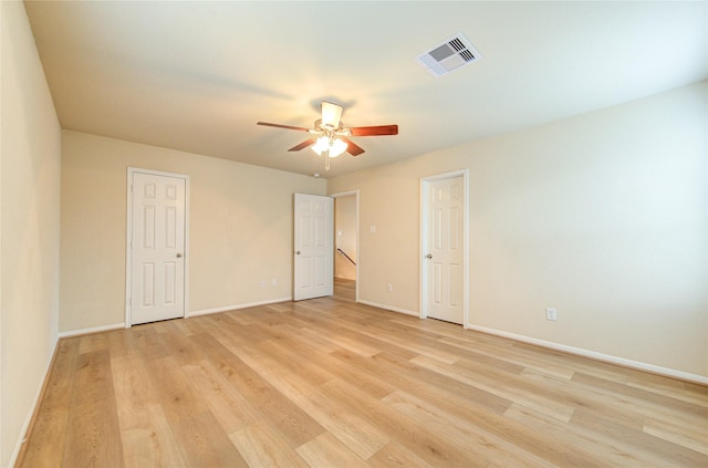 unfurnished room featuring ceiling fan and light hardwood / wood-style flooring