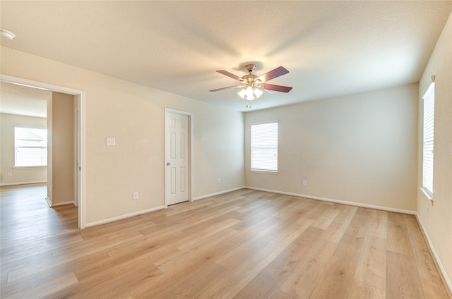 spare room featuring light hardwood / wood-style flooring and ceiling fan