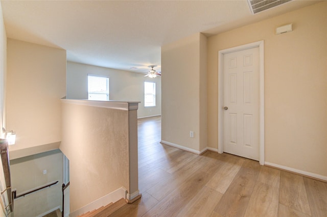 unfurnished room with light hardwood / wood-style flooring and ceiling fan