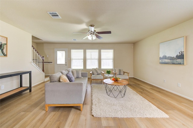 living room with ceiling fan and light hardwood / wood-style floors