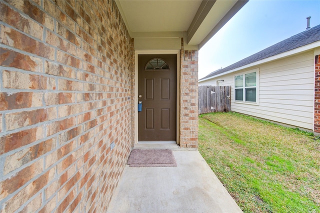 property entrance with a yard