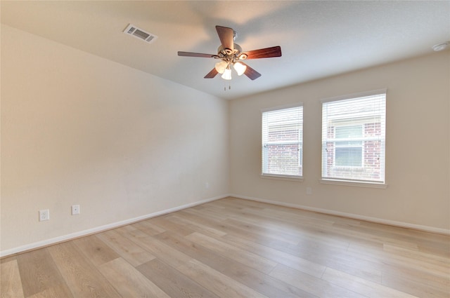 unfurnished room with ceiling fan and light wood-type flooring