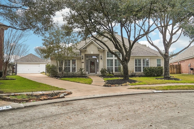 view of front of house featuring a garage and a front yard