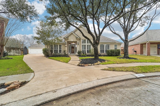 view of front of house featuring a garage and a front yard