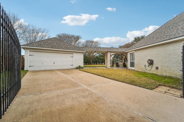 garage featuring a yard