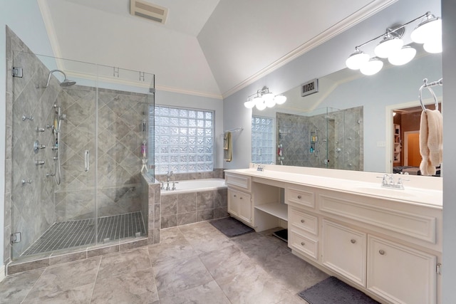 bathroom with lofted ceiling, vanity, ornamental molding, and separate shower and tub