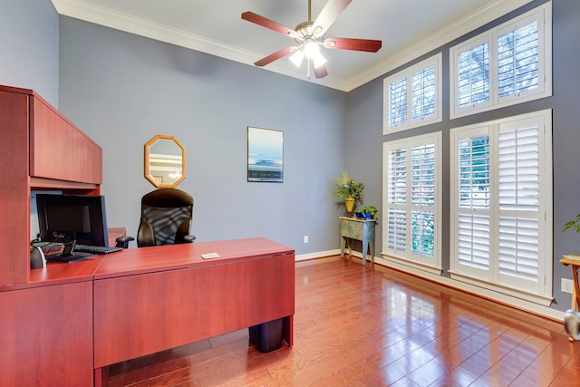 office featuring crown molding, light hardwood / wood-style flooring, and ceiling fan