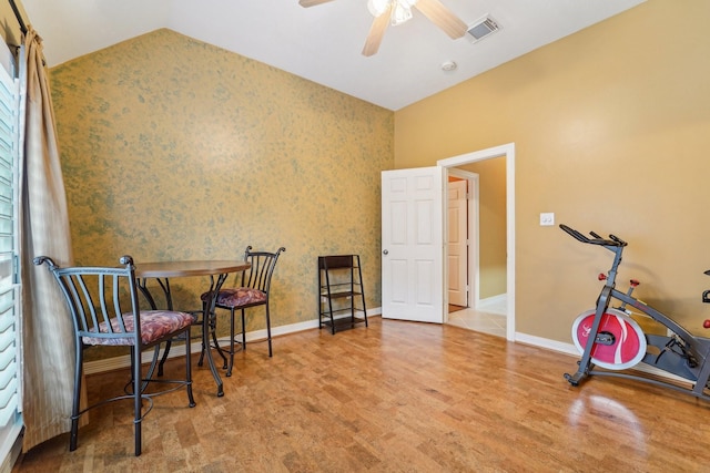 living area with hardwood / wood-style floors and ceiling fan