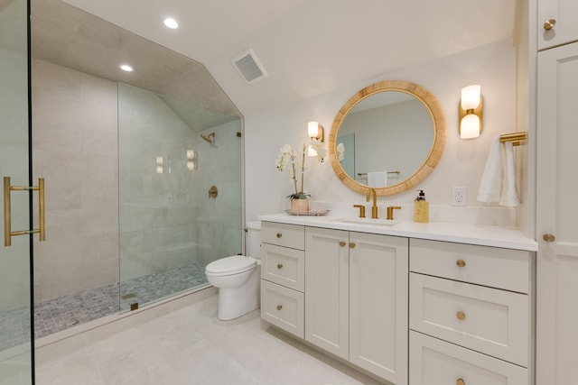 bathroom featuring a shower with door, vaulted ceiling, vanity, and toilet