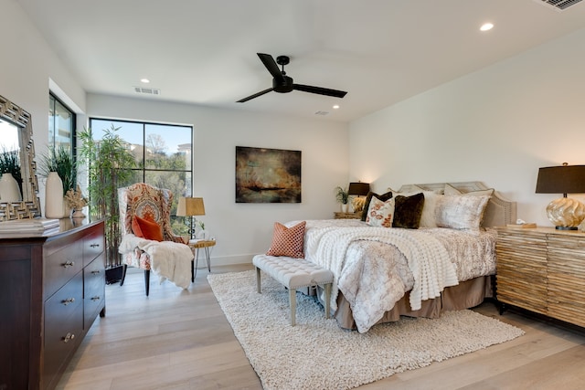 bedroom featuring ceiling fan and light wood-type flooring