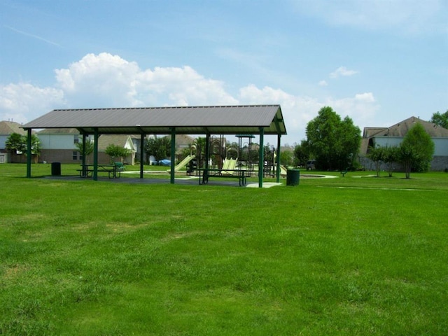 view of community with a playground and a lawn