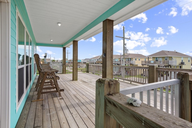 wooden deck with a residential view