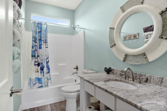 full bathroom with vanity, toilet, wood finished floors, and shower / tub combo with curtain
