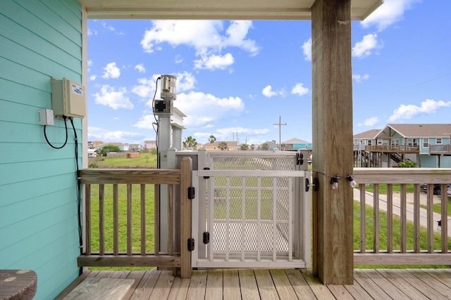 wooden terrace featuring a residential view