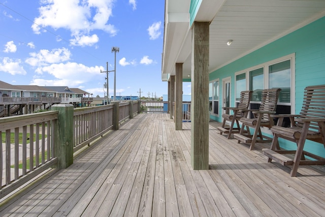 wooden terrace with a residential view