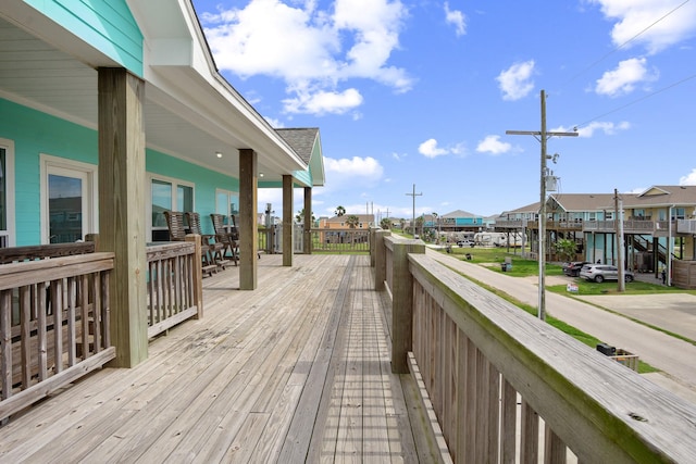 wooden deck with a residential view