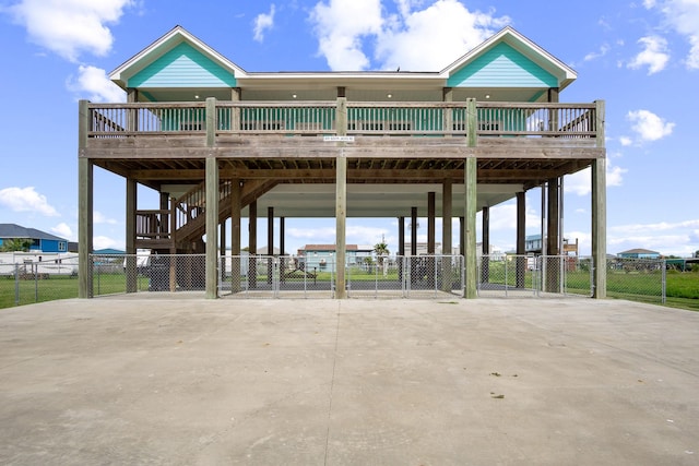 surrounding community with a carport, fence, and driveway