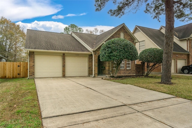 view of front facade with a garage and a front yard