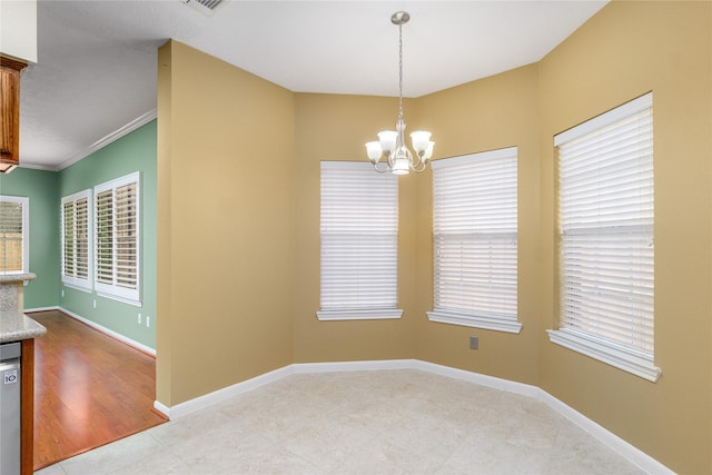 interior space featuring crown molding and a chandelier