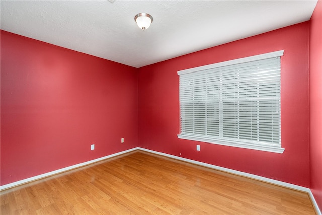 unfurnished room featuring hardwood / wood-style floors