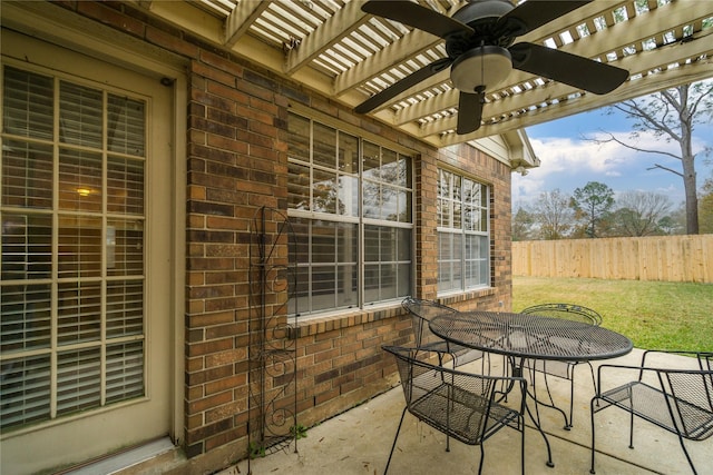 view of patio / terrace featuring a pergola and ceiling fan