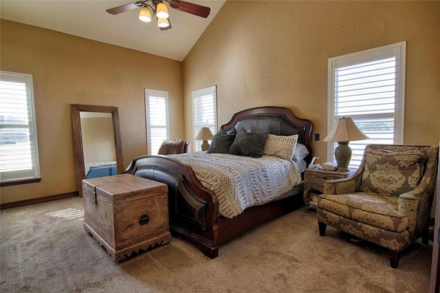 carpeted bedroom featuring ceiling fan and lofted ceiling