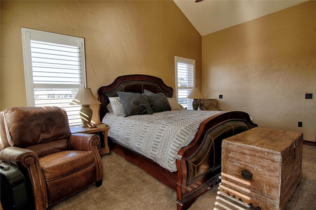 bedroom featuring vaulted ceiling and carpet floors