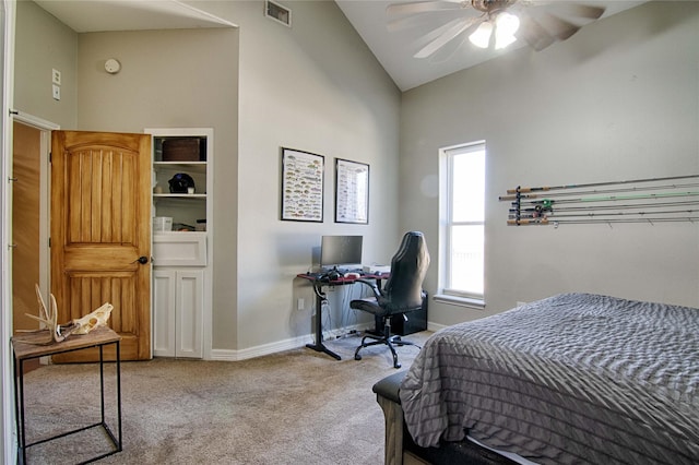 carpeted bedroom with high vaulted ceiling, baseboards, a ceiling fan, and visible vents