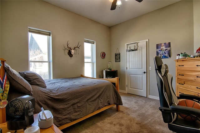 bedroom featuring ceiling fan, baseboards, and carpet floors
