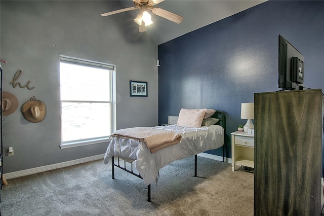 carpeted bedroom with baseboards and a ceiling fan