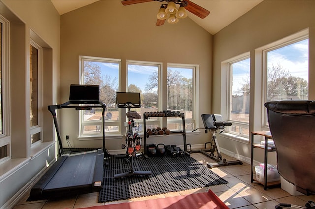 exercise area with a wealth of natural light, tile patterned floors, and a ceiling fan