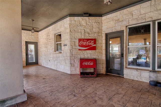 entrance to property featuring stone siding