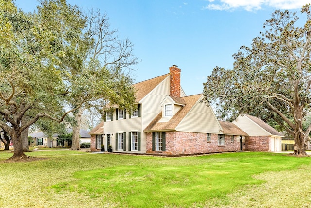 back of house with a yard