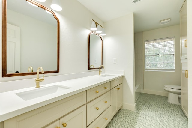 full bathroom featuring vanity, tile patterned floors, shower / bathtub combination, and toilet