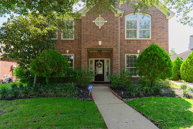 view of front of home with a front lawn